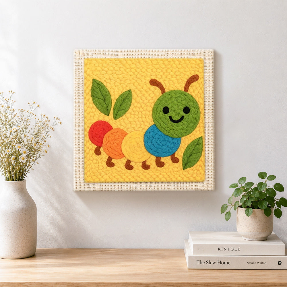 Finished colorful caterpillar artwork displayed on a wall