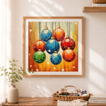 Finished colorful christmas baubles cross stitch artwork displayed as home decor