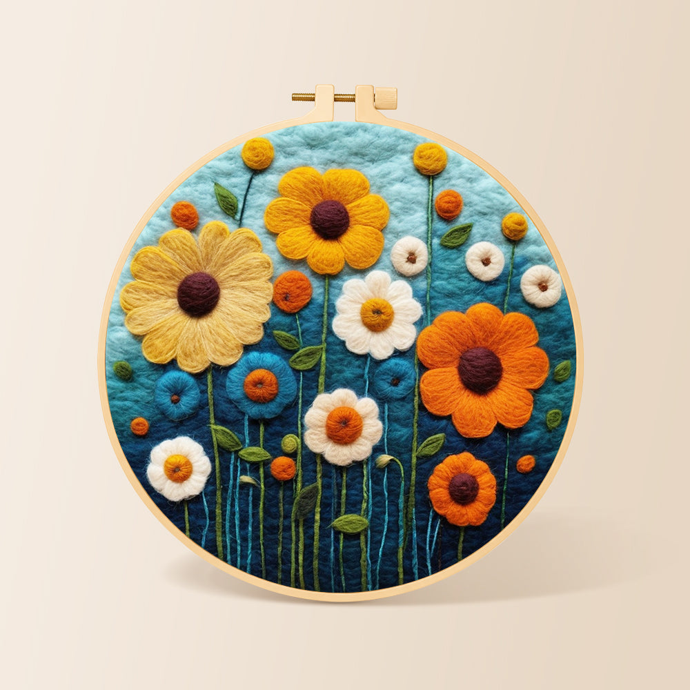 Colorful daisies on dark blue needle felting kit for beginners with a round wooden frame