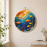 Colorful deep-sea fish needle felt wall art displayed in a bright home interior