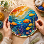 Creating the colorful deep-sea fish wool painting by hand with a felting needle