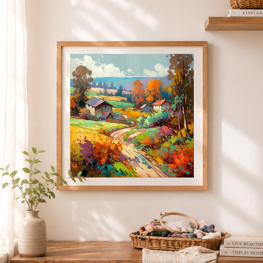 Finished colorful fall mountain hamlet cross stitch artwork displayed as home decor