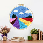 Finished colorful floral field artwork displayed on a wall
