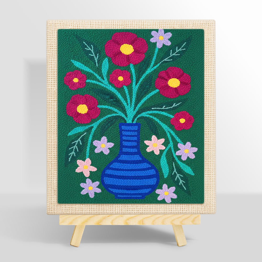 Colorful flowers in striped blue vase punch needle kit for beginners