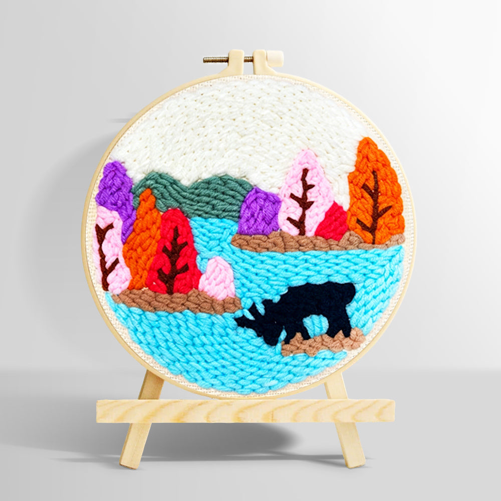 Colorful forest above a lake punch needle kit for beginners