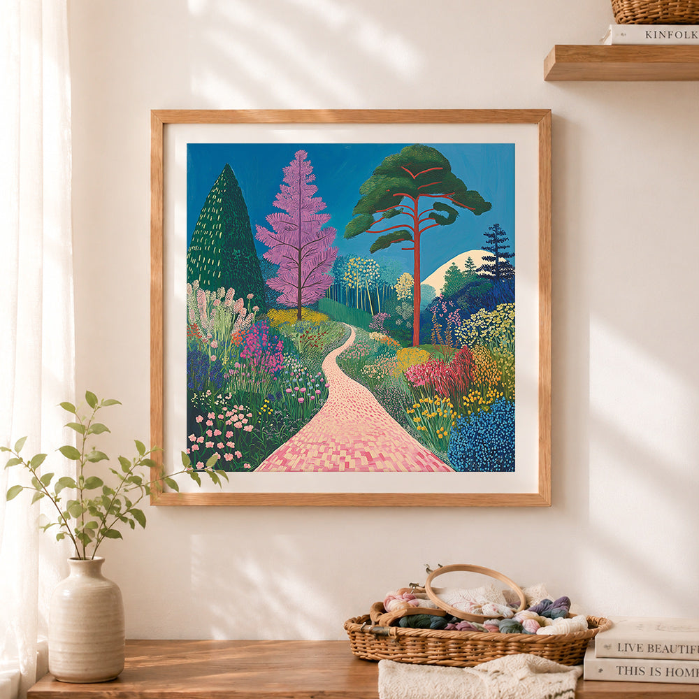 Finished colorful garden path landscape cross stitch artwork displayed as home decor