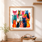 Finished colorful geometric cat family cross stitch artwork displayed as home decor
