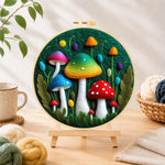 Finished colorful gradient mushrooms needle felting displayed on a wooden easel