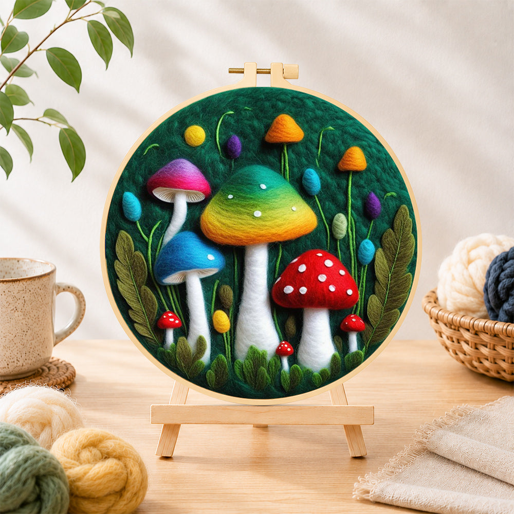 Finished colorful gradient mushrooms needle felting displayed on a wooden easel
