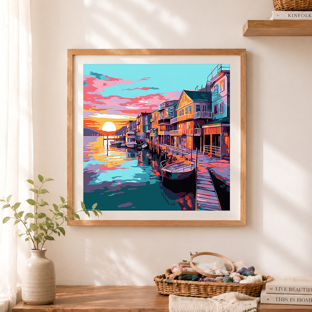 Finished colorful harbor at dusk cross stitch artwork displayed as home decor