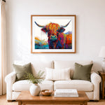 Finished colorful highland cow portrait cross stitch artwork displayed as home decor