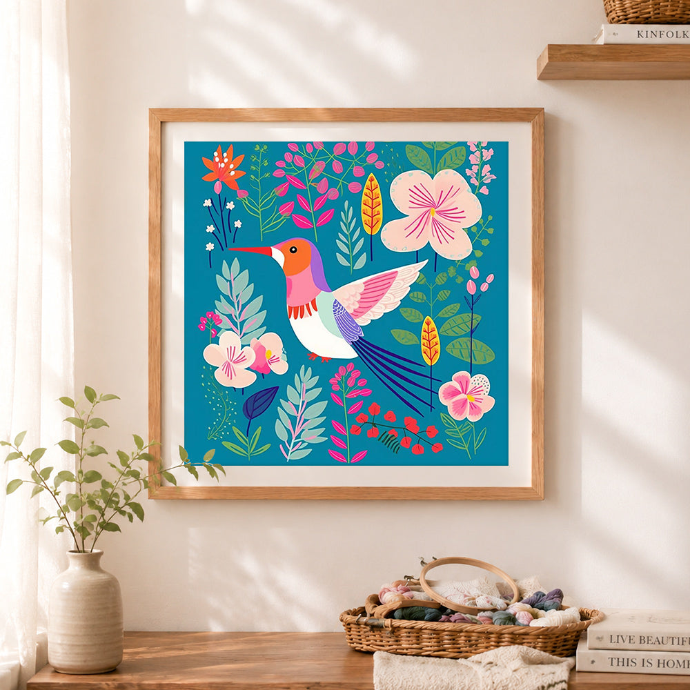 Finished colorful hummingbird floral scene cross stitch artwork displayed as home decor