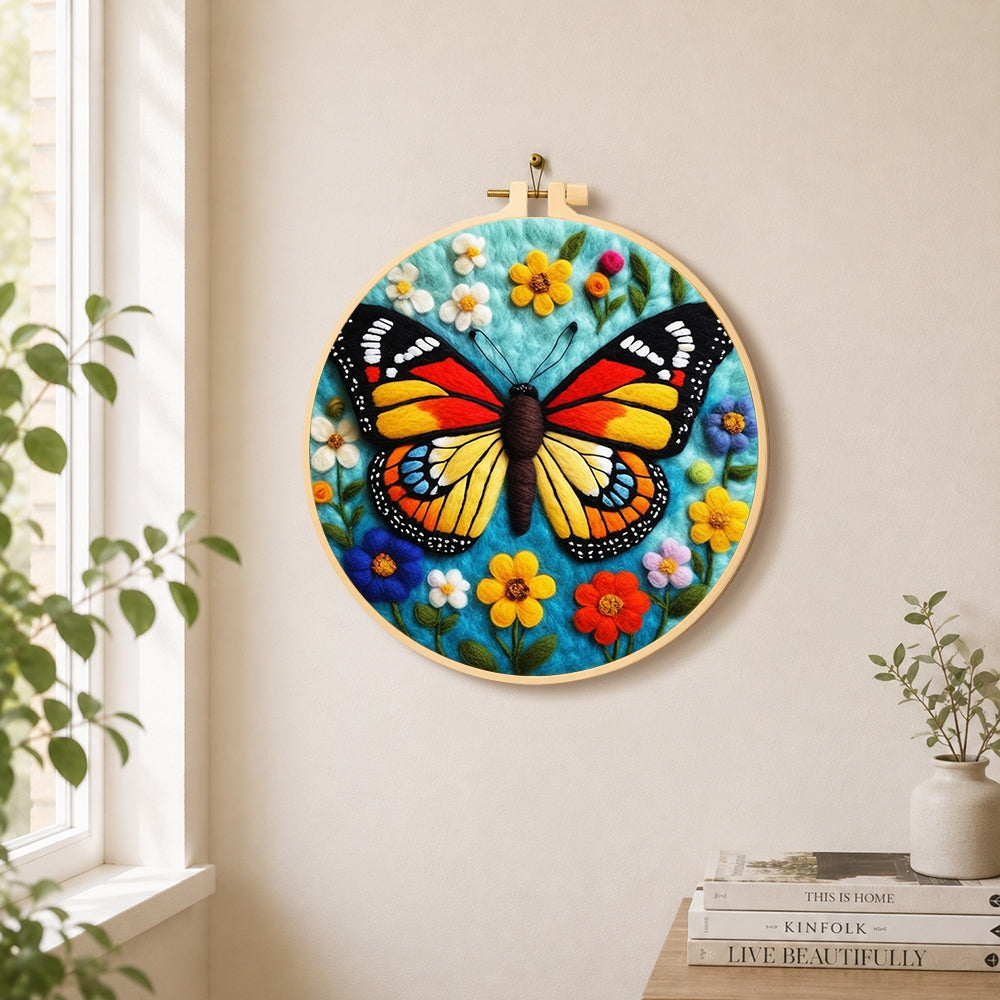 Colorful monarch butterfly and wildflowers needle felt wall art displayed in a bright home interior