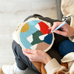 Creating handmade colorful mountain landscape punch needle artwork