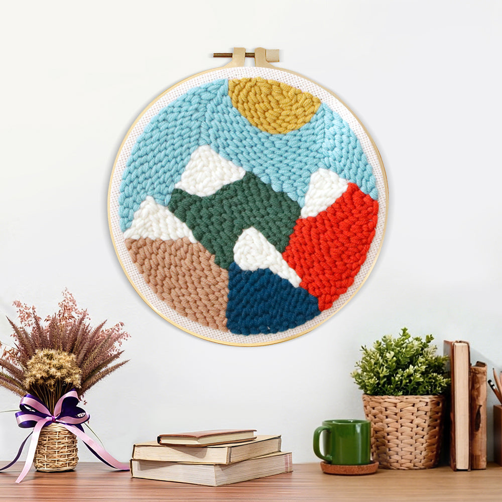 Finished colorful mountain landscape artwork displayed on a wall