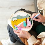 Creating handmade colorful mountains and trees punch needle artwork