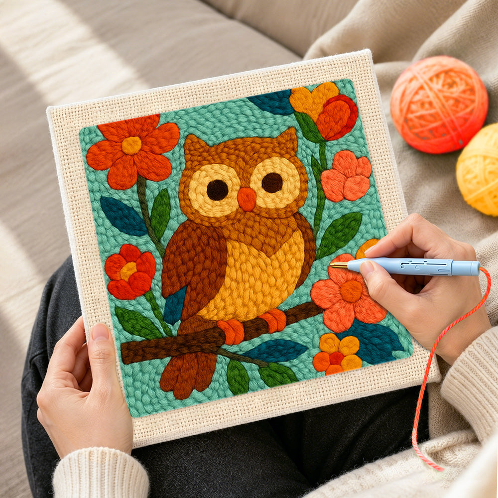 Creating handmade colorful owl on flowering branch punch needle artwork