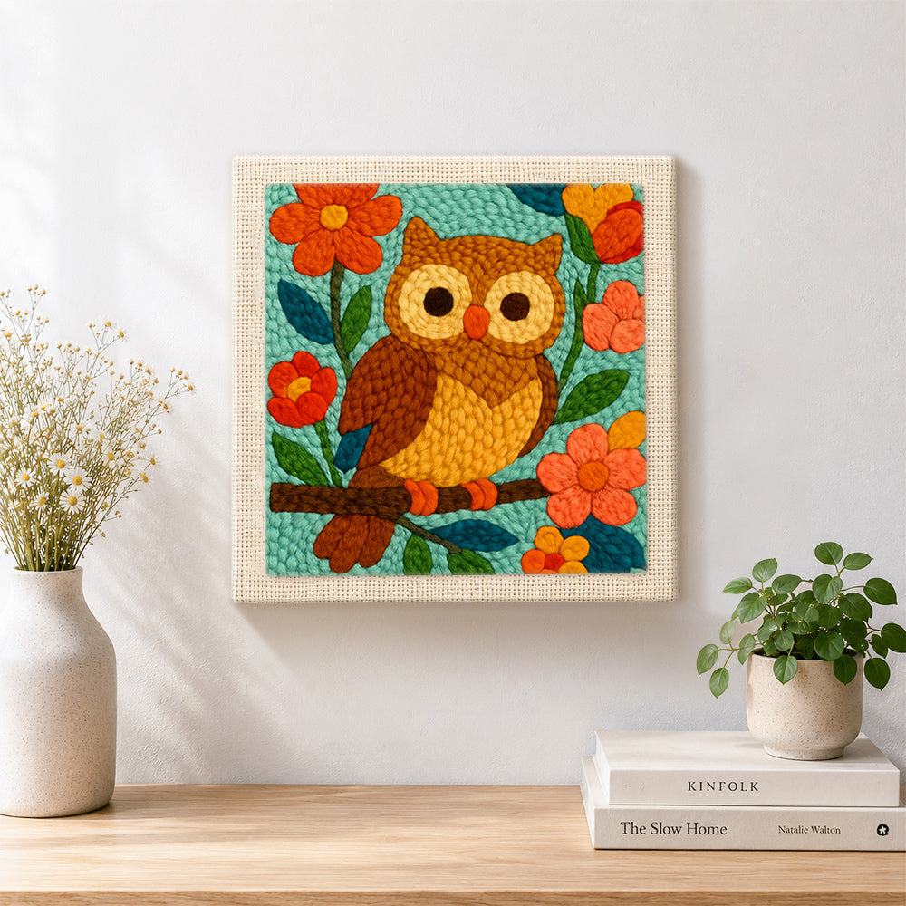 Finished colorful owl on flowering branch artwork displayed on a wall