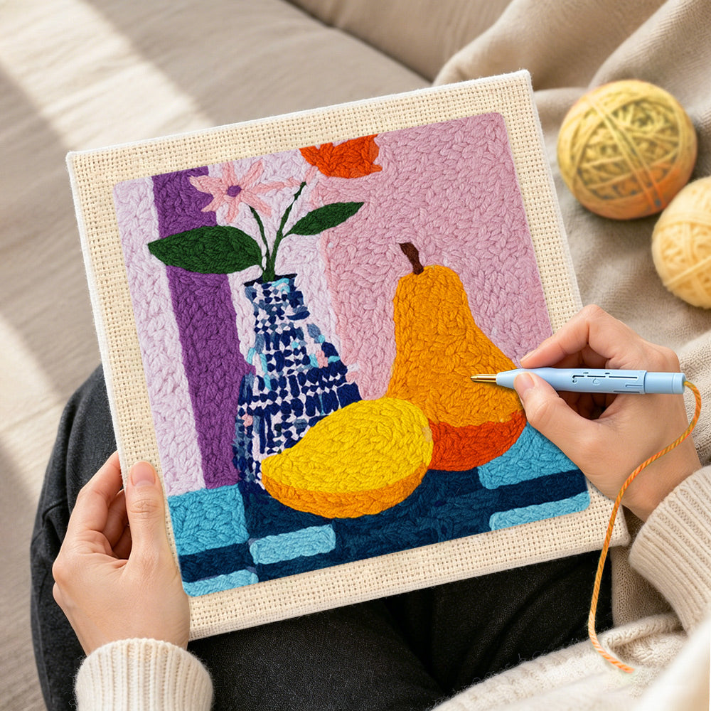 Creating handmade colorful pear and vase still life punch needle artwork