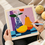 Creating handmade colorful pear and vase still life punch needle artwork