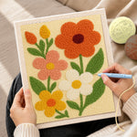 Creating handmade colorful petal flowers punch needle artwork