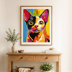 Finished colorful pop kitten cross stitch artwork displayed as home decor