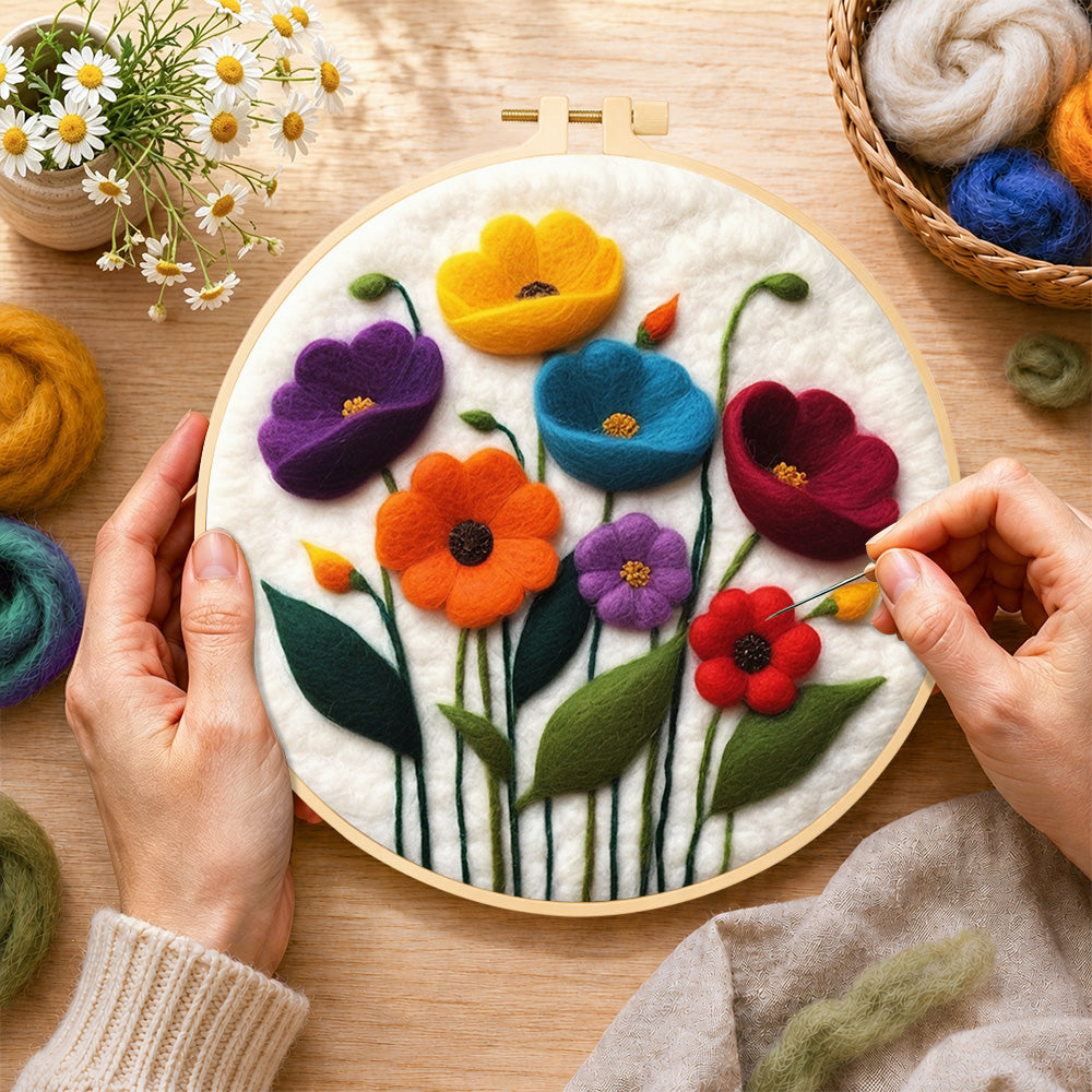 Creating the colorful poppies wool painting by hand with a felting needle