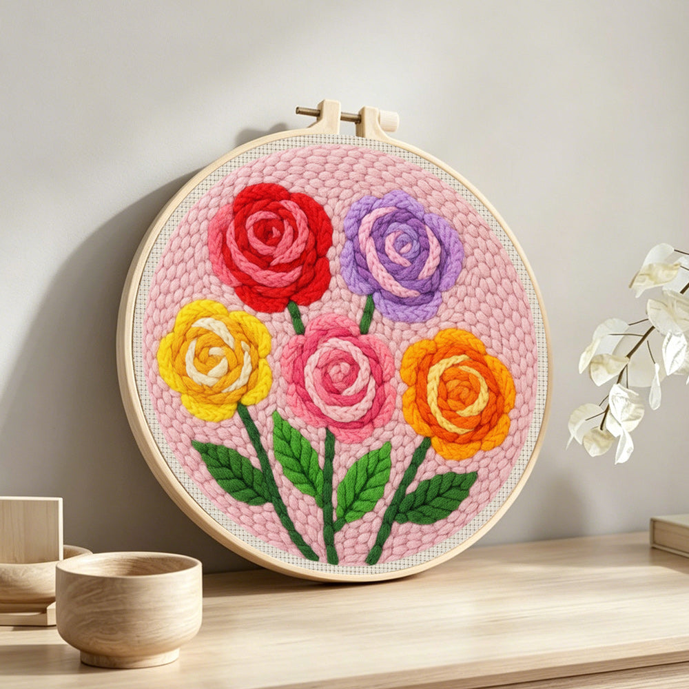 Colorful rose bouquet punch needle artwork displayed on a table