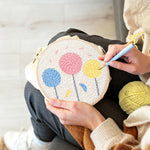Creating handmade colorful round flowers punch needle artwork