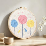 Colorful round flowers punch needle artwork displayed on a table