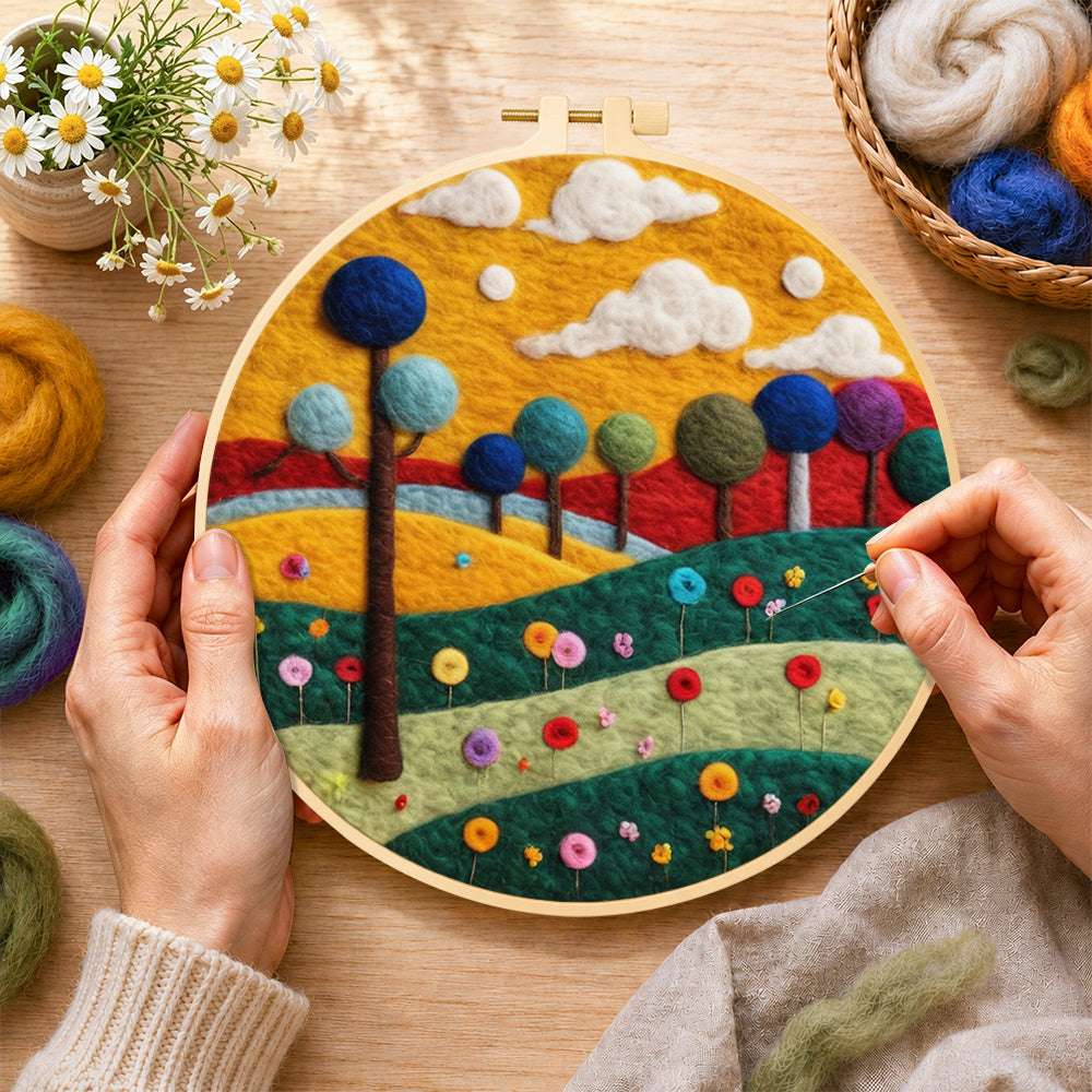 Creating the colorful round trees on whimsical hills wool painting by hand with a felting needle
