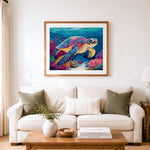 Finished colorful sea turtle underwater cross stitch artwork displayed as home decor