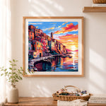 Finished colorful seaside harbor cross stitch artwork displayed as home decor