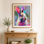 Finished colorful splash rabbit cross stitch artwork displayed as home decor