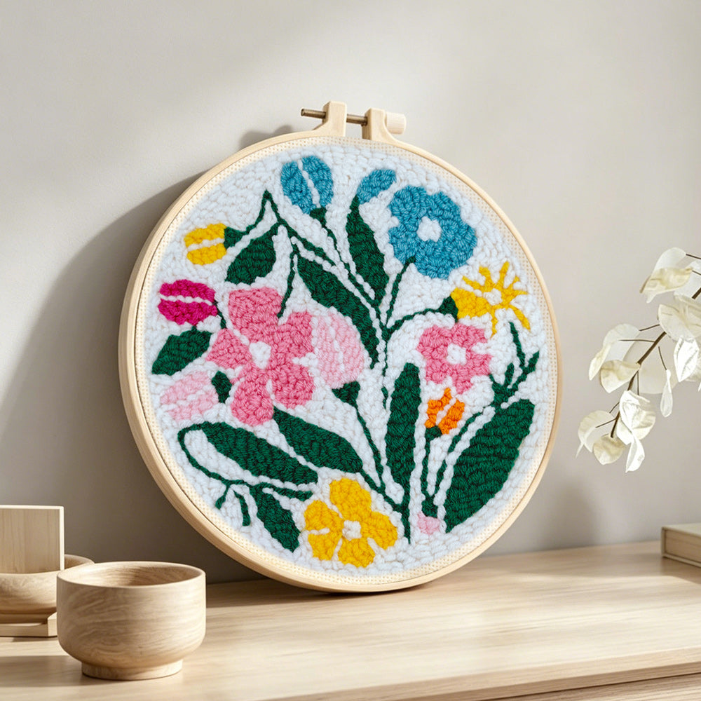 Colorful summer blooms punch needle artwork displayed on a table