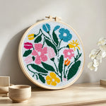 Colorful summer blooms punch needle artwork displayed on a table