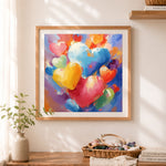 Finished colorful thick impasto hearts cross stitch artwork displayed as home decor