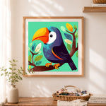 Finished colorful toucan bird cross stitch artwork displayed as home decor