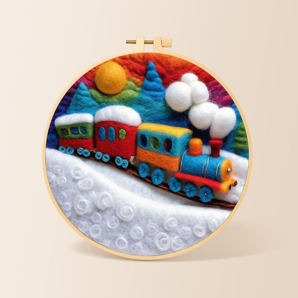 Colorful train on snowy hills needle felting kit for beginners with a round wooden frame