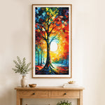 Finished colorful tree with glowing sun cross stitch artwork displayed as home decor