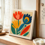 Colorful tulips punch needle artwork displayed on a table