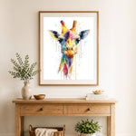 Finished colorful watercolor giraffe cross stitch artwork displayed as home decor