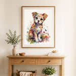 Finished colorful watercolor puppy cross stitch artwork displayed as home decor