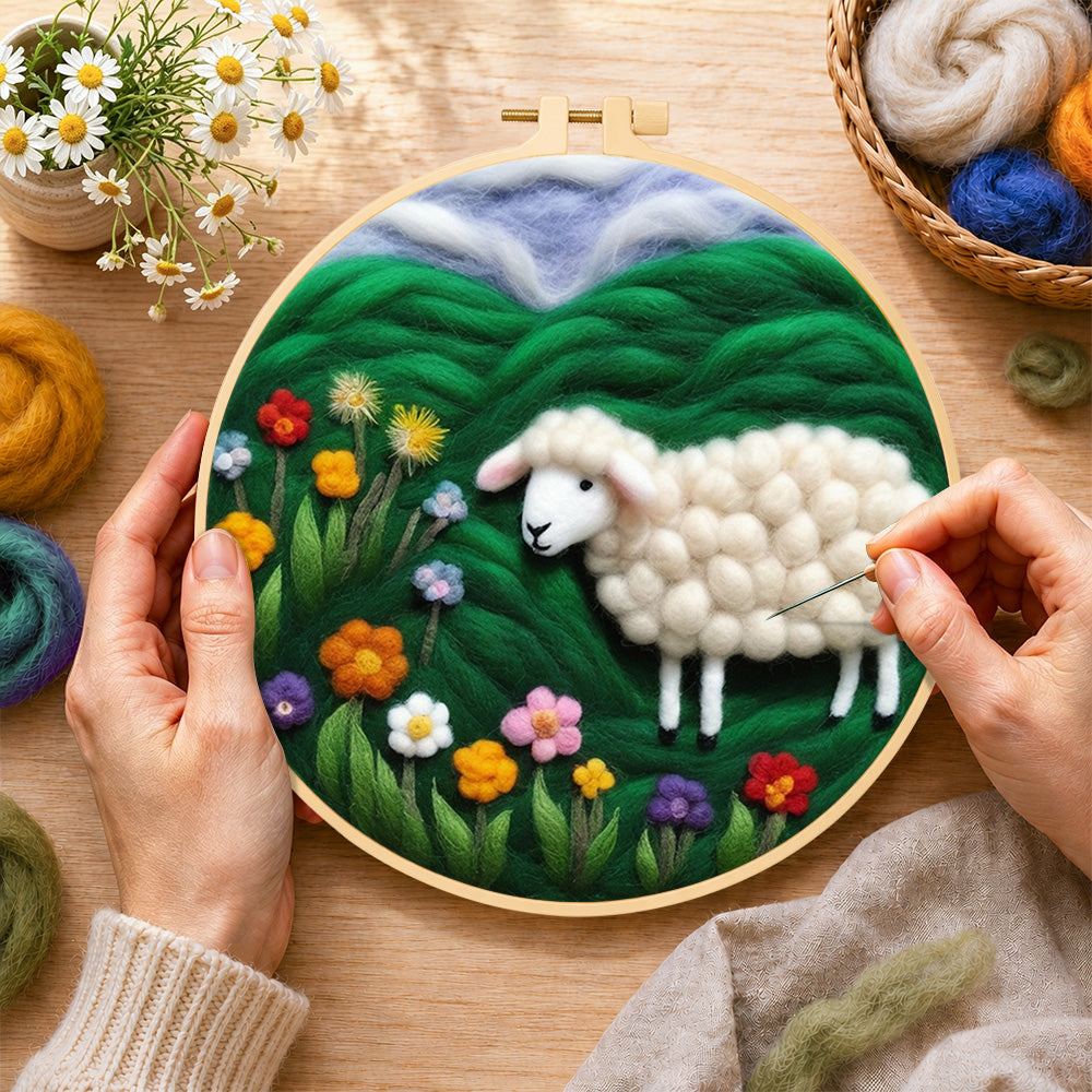 Creating the colorful wildflower meadow with a sheep wool painting by hand with a felting needle