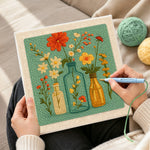 Creating handmade colorful wildflowers in the glass bottles punch needle artwork