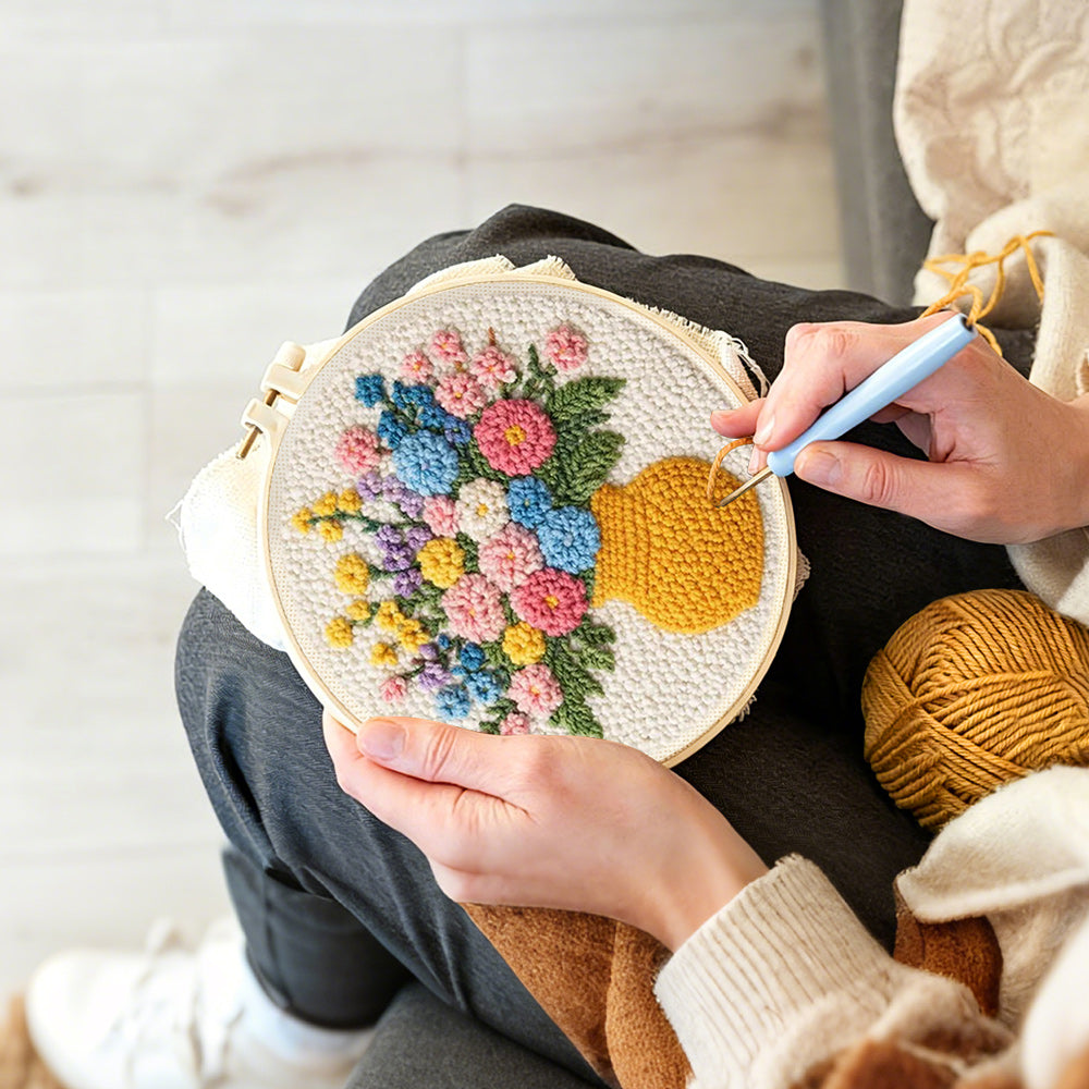 Creating handmade colorful wildflowers in yellow vase punch needle artwork
