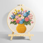 Colorful wildflowers in yellow vase punch needle kit for beginners