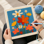 Creating handmade colorful wildflowers punch needle artwork