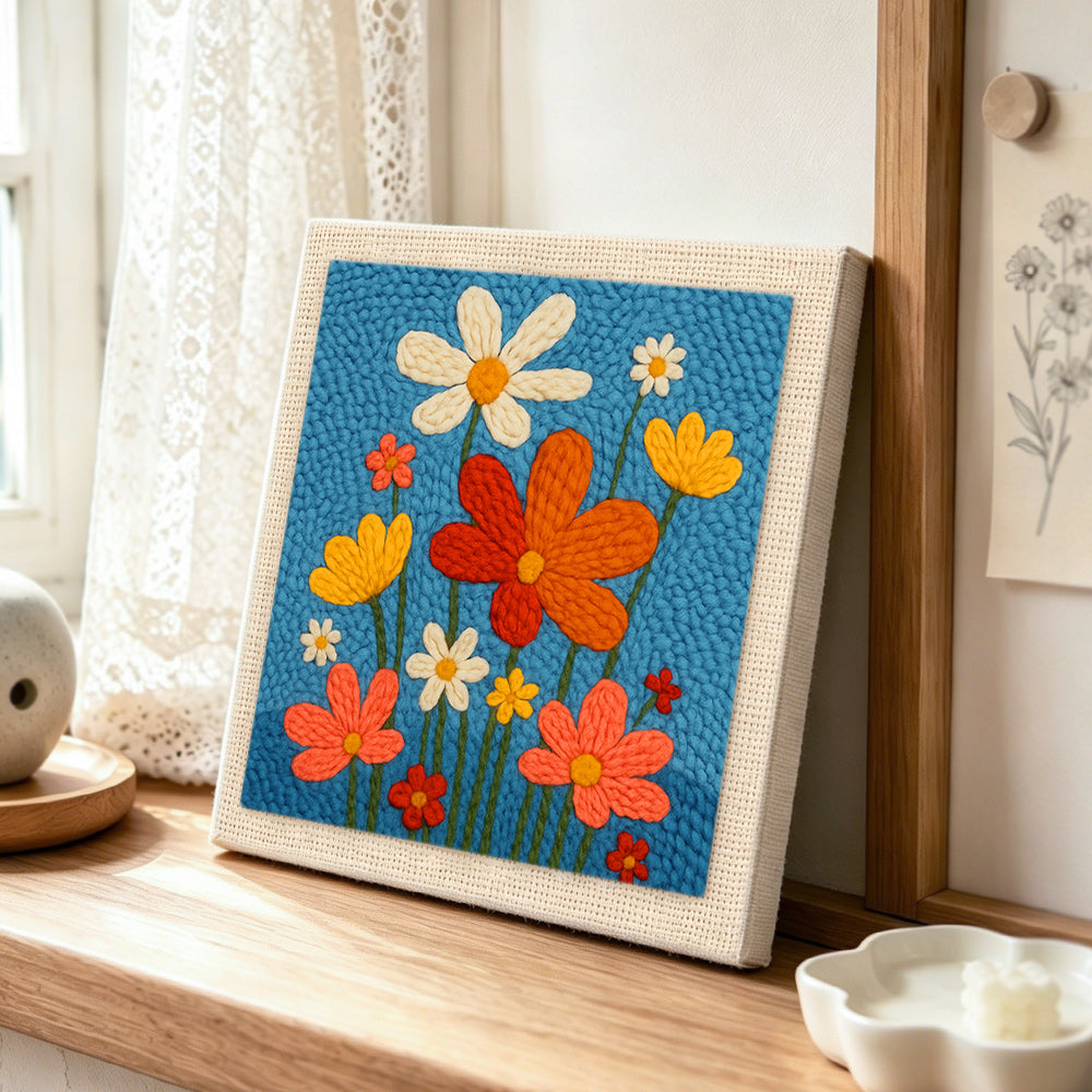 Colorful wildflowers punch needle artwork displayed on a table