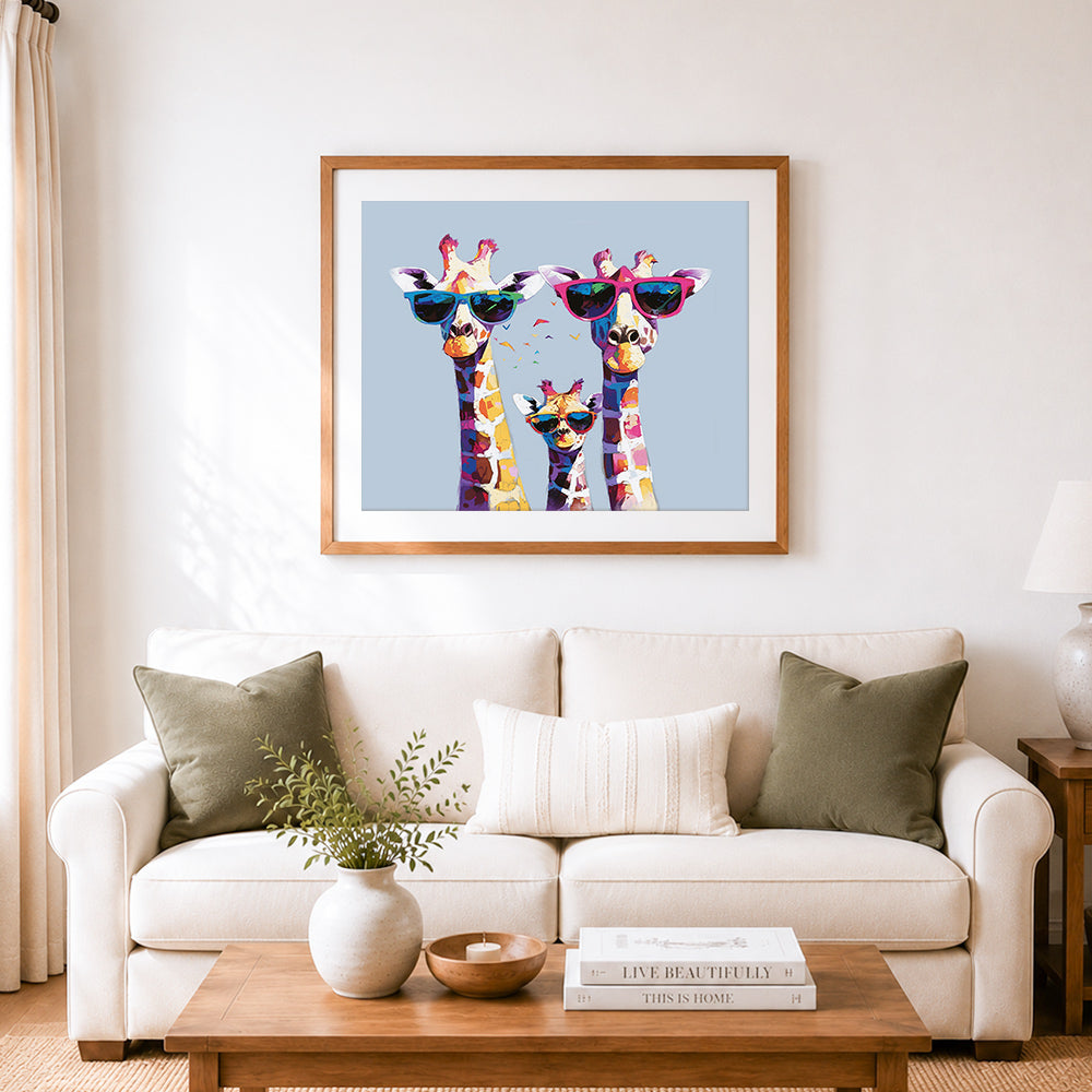 Finished cool giraffe family cross stitch artwork displayed as home decor